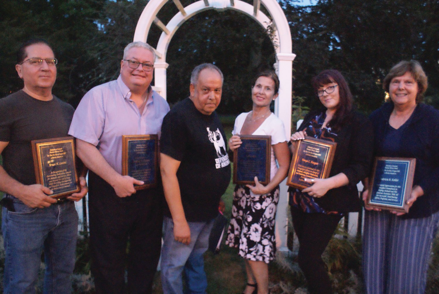 AWARD WINNERS: Dennis Tabella, director of Defenders of Animals, poses with the five individuals who received Humane Hero awards at the 27th annual Homeless Animals Day/Candlelight Vigil on Aug. 21 at Sprague Mansion in Cranston. He is joined by, from left, Bruce Lossini, William W. O’Brien, Robin Aptt, Tonya C. Keegan and Patricia Kohler.